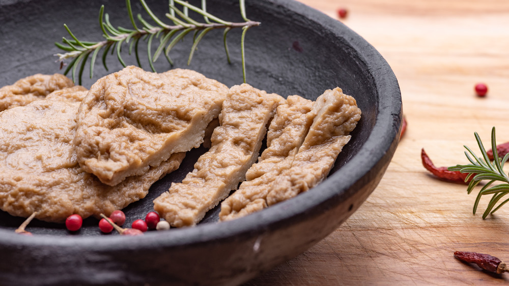 Seitan or fake meat in a black bowl