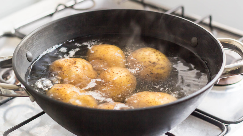 Potatoes in pan of water