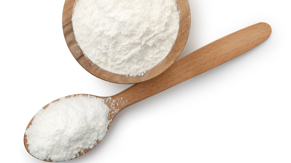 Wooden bowl and spoon with cornstarch