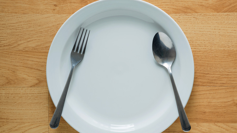 Fork and spoon on a white plate