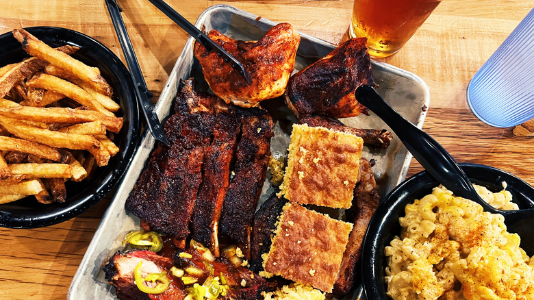 Barbecue platter with meat, fries, and cornbread