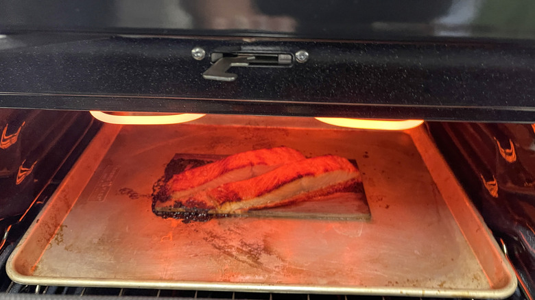 glazed salmon filets broiling in oven