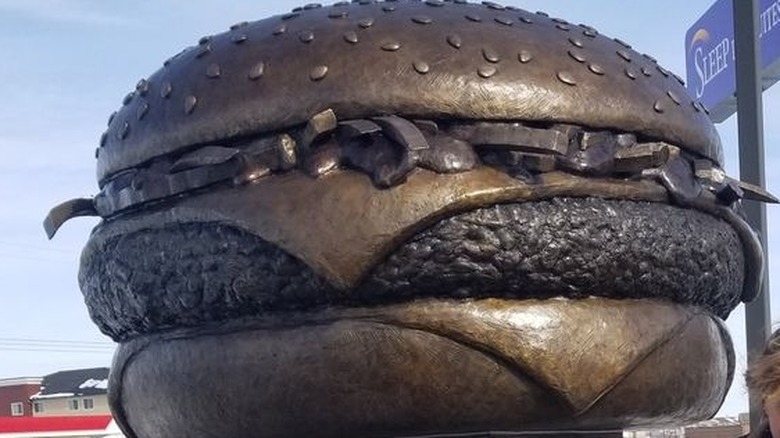 Bronze statue of a cheeseburger 