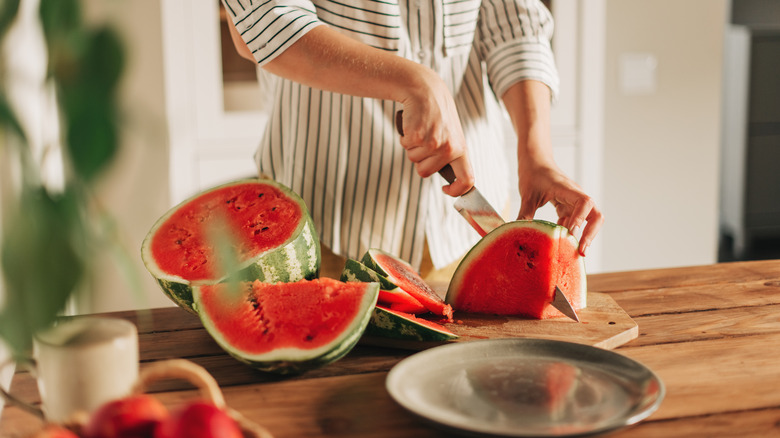 Slicing whole watermelon