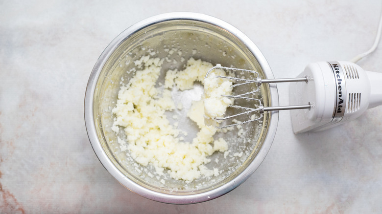 creamed butter in mixing bowl