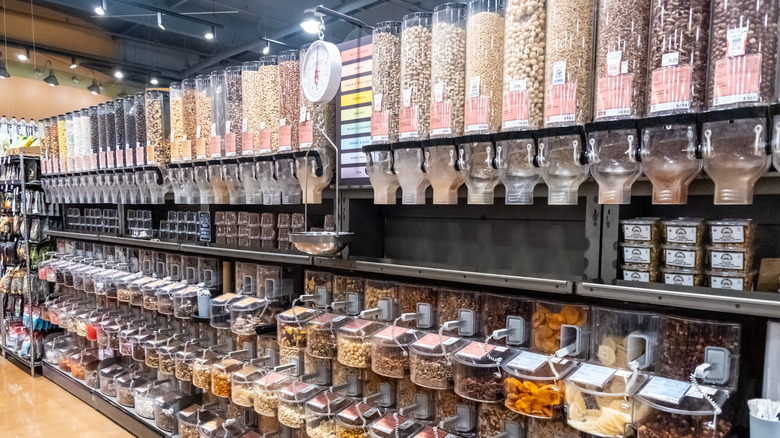 aisle of bulk food dispensers at Whole Foods