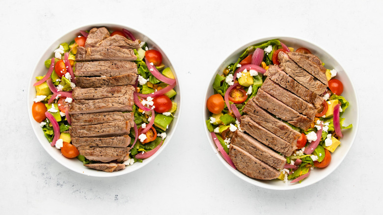 Two bowls of steak taco salad