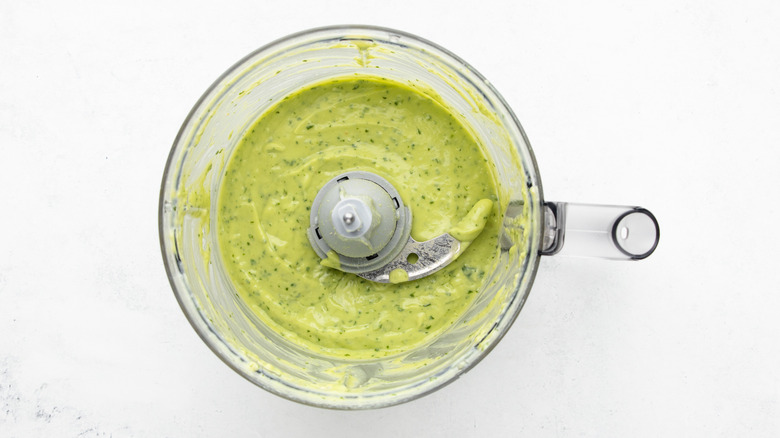 Avocado salad dressing mixture in food processor