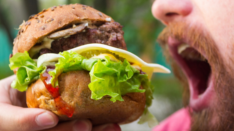 Man eating processed food 