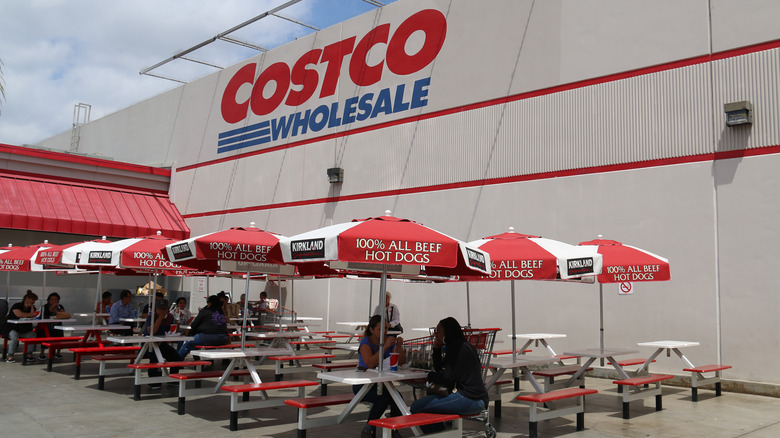 People seated outside Costco