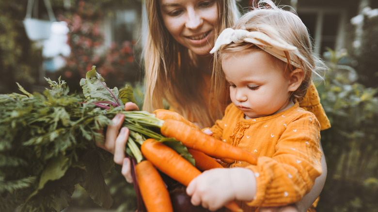 Mother and child with carrots 