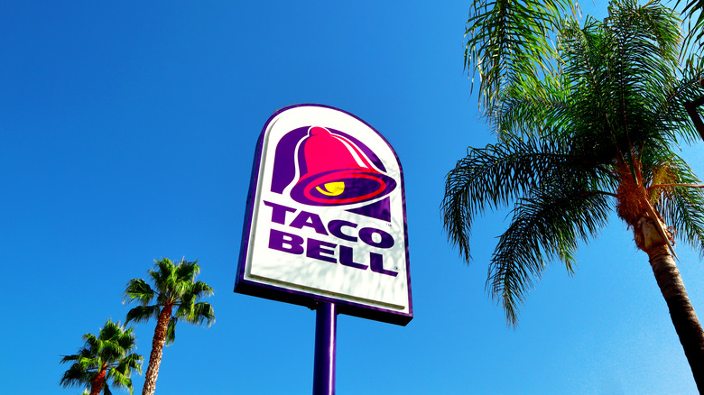 taco bell sign with palm trees