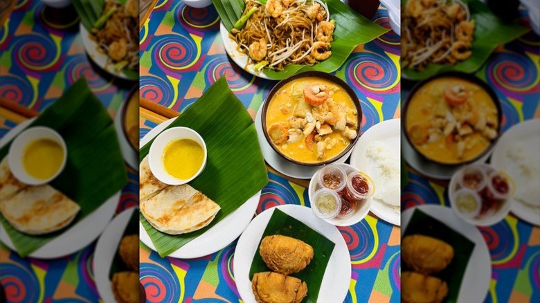 Spread of Thai food on a patterned table