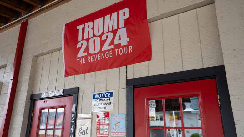 Trump 2024 Revenge tour flag above store front