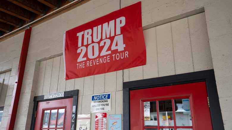 Trump 2024 Revenge tour flag above store front