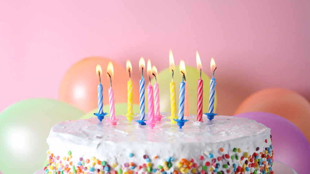 birthday cake with lit candles