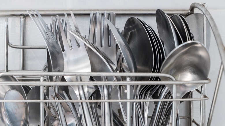 Shining, clean silverware in dishwasher