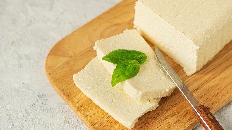 Knife next to sliced tofu