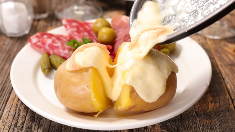 Melted raclette over potatoes