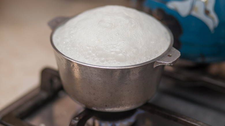 Boiling milk in metal pot