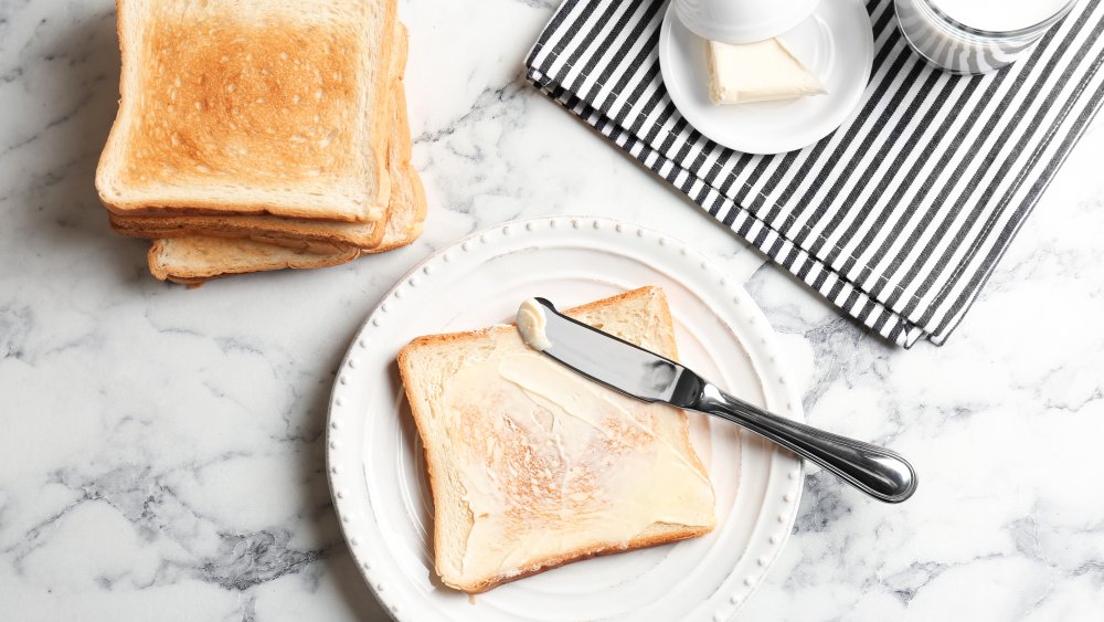 Use a bread knife to scrape cold butter and spread it easily