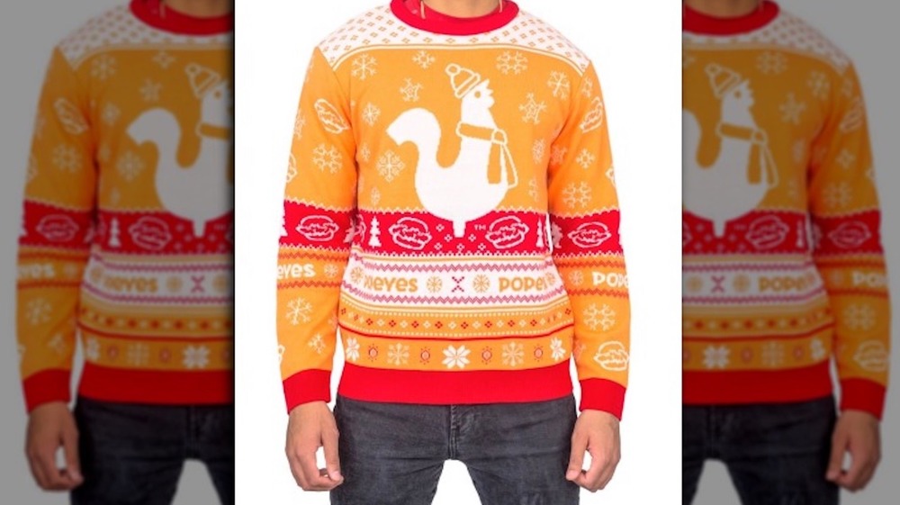 Man wearing Popeyes ugly Christmas sweater