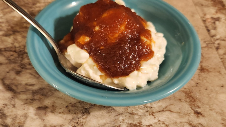 A scoop of cottage cheese with apple butter in a bowl