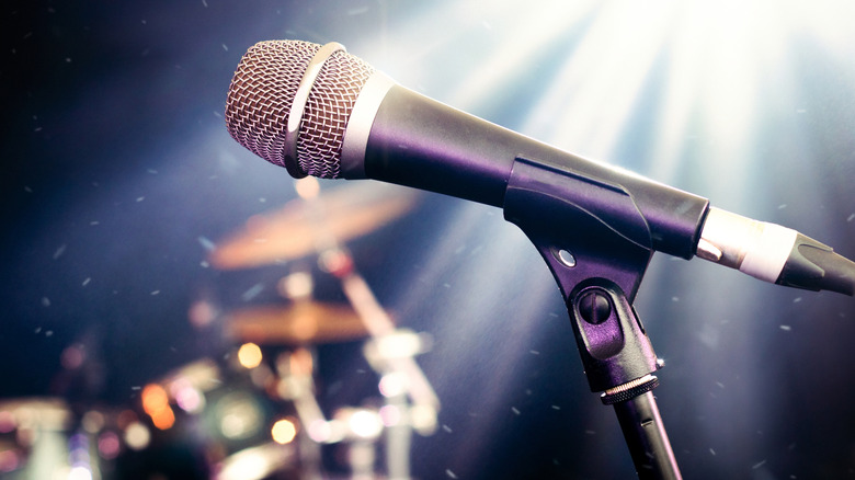 Microphone on stage with dramatic spotlight
