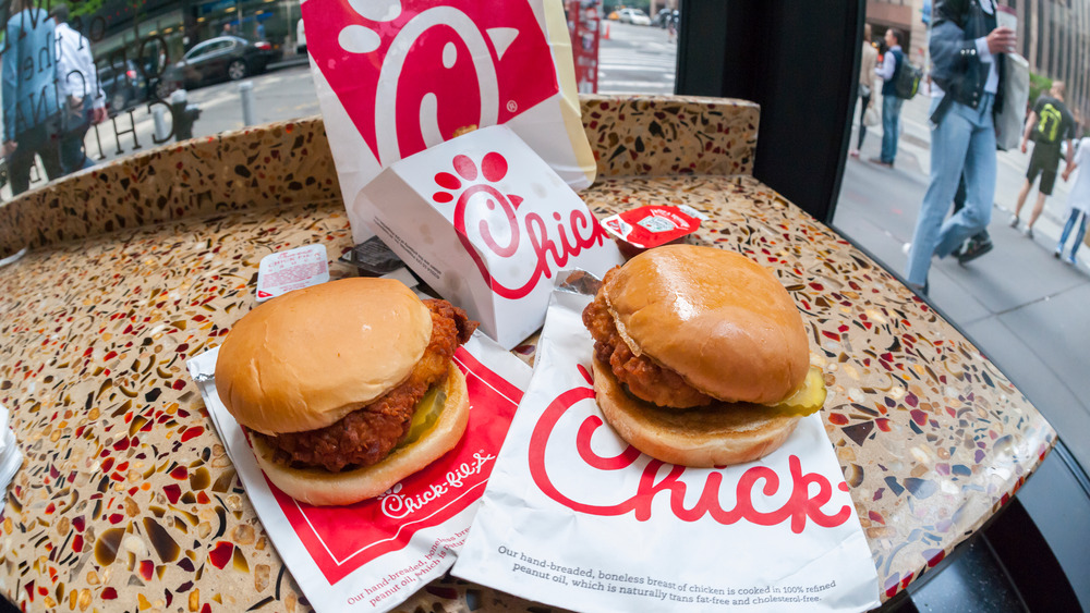 Chick-Fil-A sandwiches sitting on top of bags