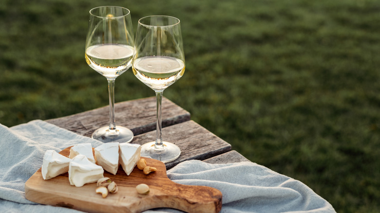 Champagne and cheese on a table