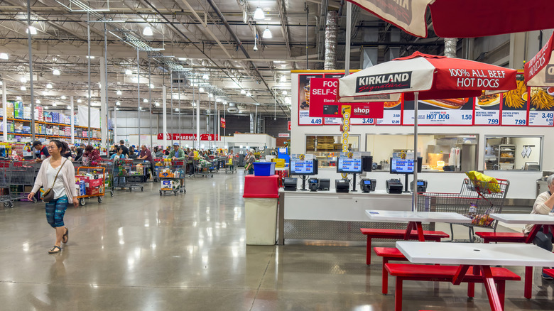 Customers shopping inside a Costco warehouse.