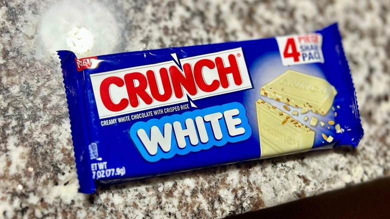 Unopened Crunch White candy bar on kitchen counter