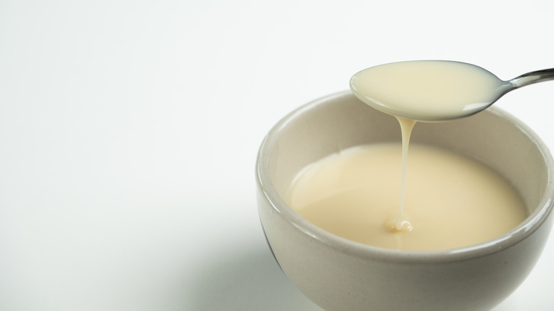 Bowl and spoon of condensed milk
