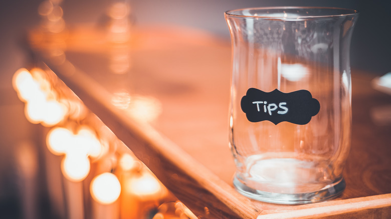 Tip jar on wooden countertop