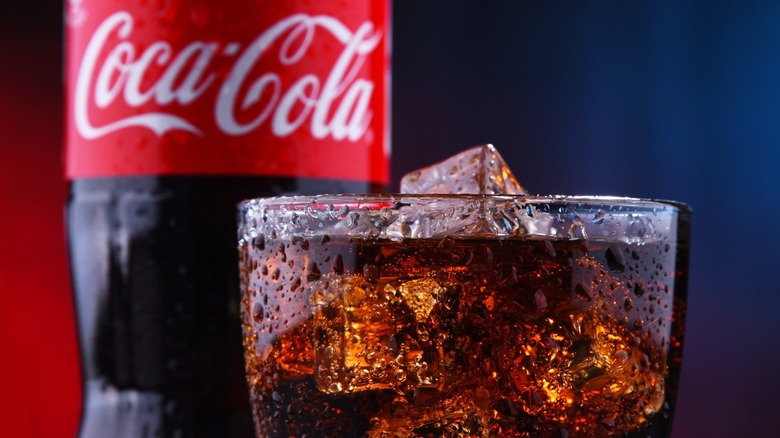 Coca-Cola bottle with rocks glass