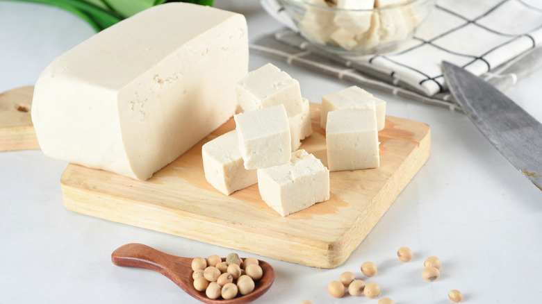 Tofu on wooden cutting board