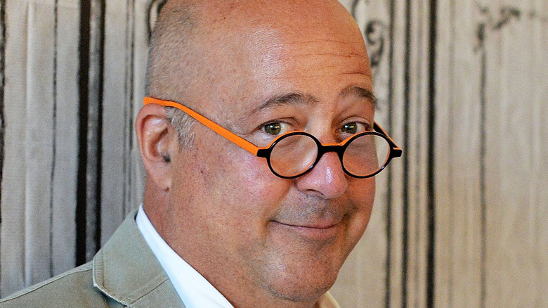 Bizarre Foods' Andrew Zimmern in orange-rimmed glasses