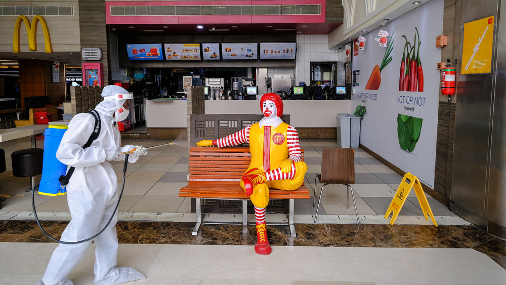 Ronald McDonald and a sanitation worker