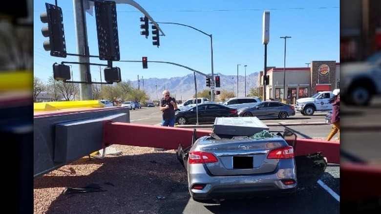 A car damaged by a McDonald's sign