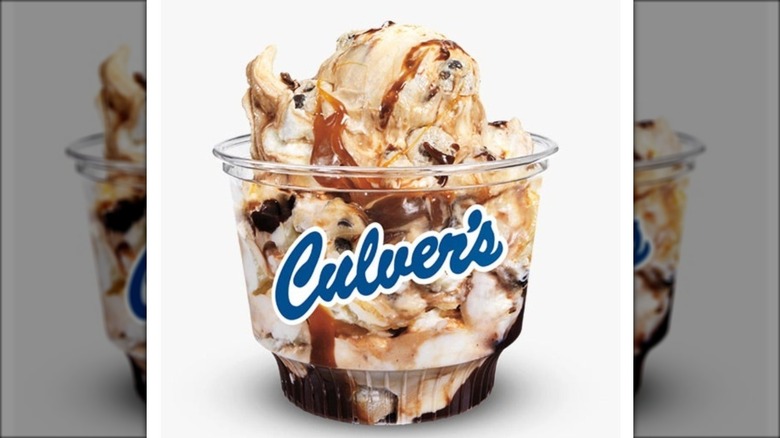 Cup of Culver's caramel fudge cookie dough against white background.