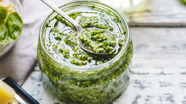 Jar of pesto with spoon