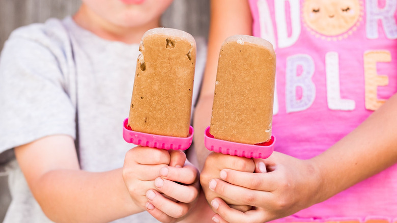 kids holding homemade pudding pops