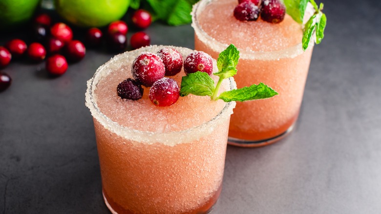 frozen cocktails garnished with cranberries