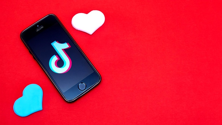 TikTok logo red back ground 2 hearts