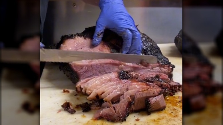 Chef slicing beef brisket