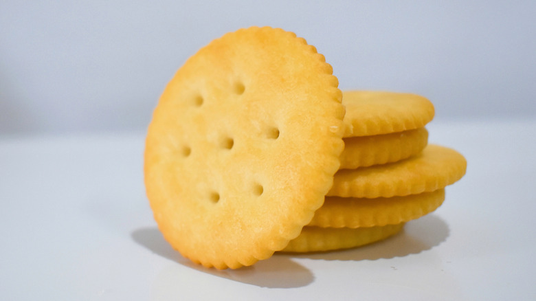 Stack of Ritz crackers against a white background