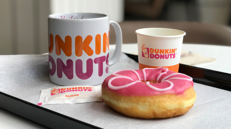 A cup of coffee and a donut from Dunkin'