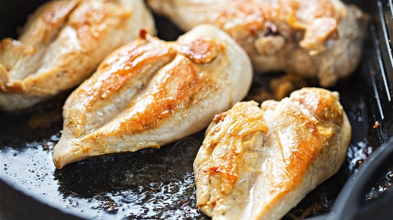 Cooking chicken in a pan
