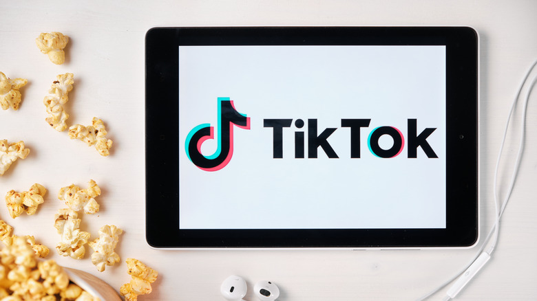 tiktok on tablet with popcorn