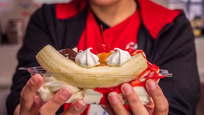 Sonic worker holding banana split